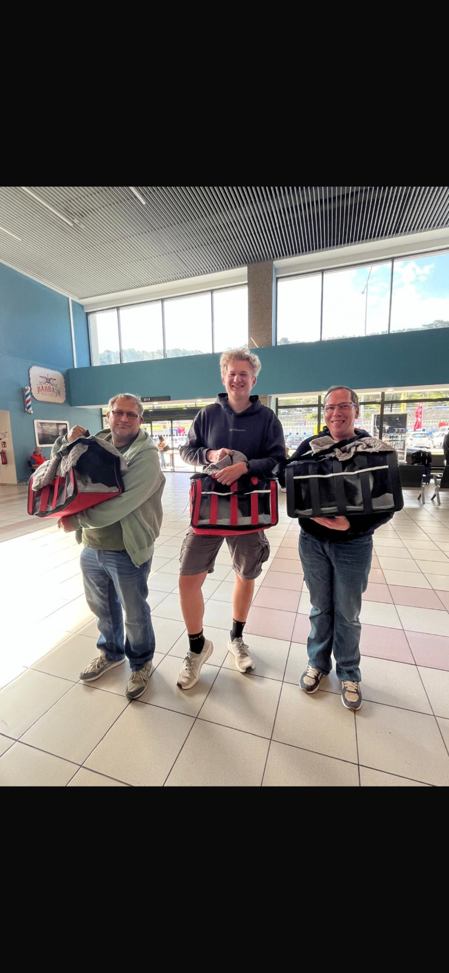 Rescued cats leaving the airport with their new families